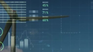Yel değirmeninin dönmesi ve mavi gökyüzüne karşı istatistiksel veri işlemenin birleşik videosu. iş istatistikleri ve veri kavramı