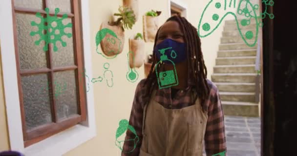 Animatie Van Viruspictogrammen Afrikaanse Amerikaanse Vrouw Met Gezichtsmasker Die Temperatuur — Stockvideo