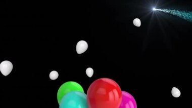 Animation of flying colorful balloons and lights over black background. party and celebration concept digitally generated video.