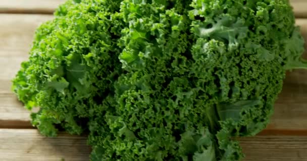 Animation 100 Percent Natural Text Green Kale Wooden Background World — Video