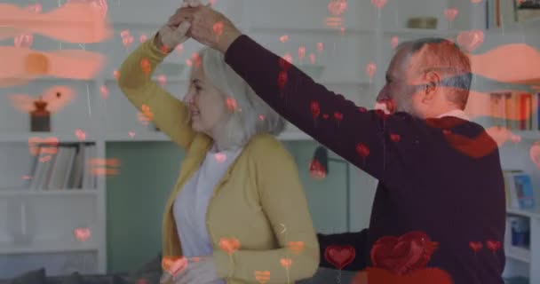 Animation Von Herz Ikonen Über Älteren Kaukasischen Paartänzen Zeit Hause — Stockvideo