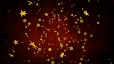Sarı yıldızların hareketi ve kırmızı arkaplanda lekeler. parti ve kutlama konsepti dijital olarak oluşturulmuş video.