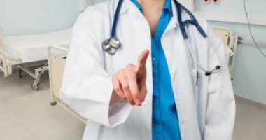 Hasta odasının üzerinde steteskopu olan beyaz kadın doktor animasyonu. Ulusal kanser günü ve dijital olarak üretilen video konsepti.