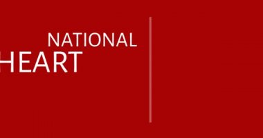 Kırmızı arka planda Ulusal Kalp Günü metninin animasyonu. kalp ayı ve kutlama konsepti dijital olarak oluşturulmuş video.