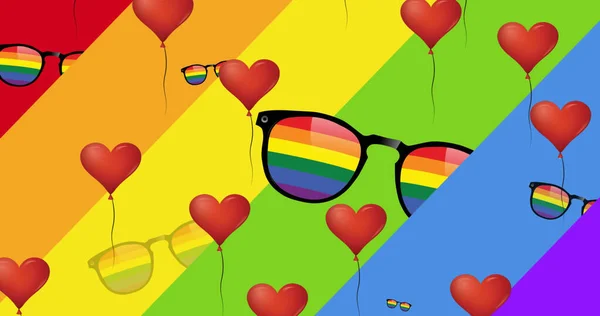 虹色の背景に虹色のメガネの上の心のイメージ プライドの月とお祝いのコンセプトをデジタルで — ストック写真