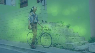 Bisikletle yürüyen Afro-Amerikan bir adamın üzerinde hareket eden şekillerin animasyonu. pedal günü ve dijital olarak üretilen video konsepti.