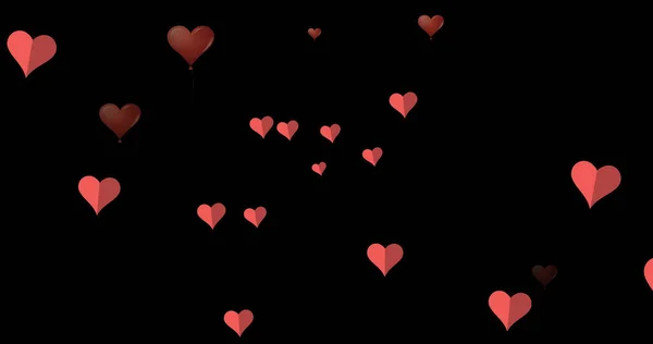 黒の背景に浮かぶピンク色のハートのイメージ バレンタインデー愛とロマンスのコンセプトをデジタルで生成した画像 — ストック写真