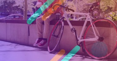 Albino Afrikalı Amerikalı bir adamın bisikletle oturması üzerine şekillerin animasyonu. pedal günü ve dijital olarak üretilen video konsepti.