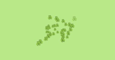 Yeşil arka planda oluşan çoklu yonca yapraklarının dijital animasyonu. Mutlu Aziz Patrick bayramı kutlaması..
