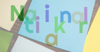 Not üzerine çok renkli harflerle ulusal çıkartma gününün animasyonu. Ulusal çıkartma günü konsepti dijital olarak oluşturulmuş video.