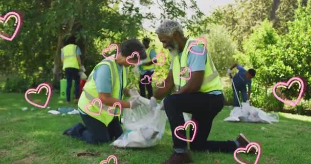 Animation Hearts Moving Happy African American Family Picking Rubbish Countryside — Stock Video