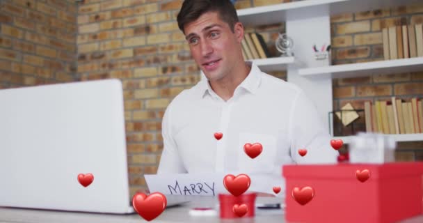 Animation Red Hearts Flying Caucasian Man Proposing Laptop Video Call — Stock Video