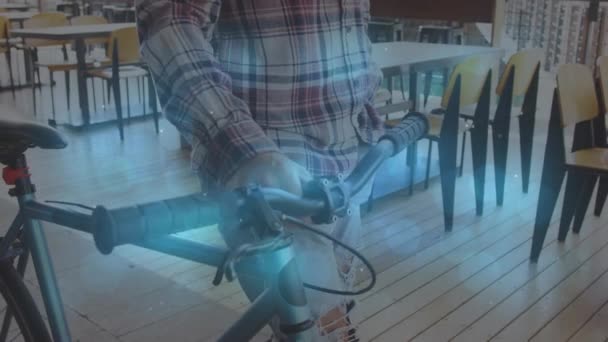 Animação Formas Que Movem Sobre Homem Biracial Andando Com Bicicleta — Vídeo de Stock