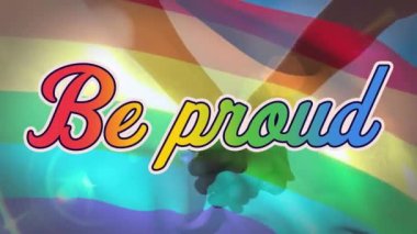 Eşitlik bayrağı sallayan ve el ele tutuşan çiftler üzerine gökkuşağı renkleri olan Gururlu Metnin Animasyonu. LGBT eşitlik renk hareketi konsepti dijital olarak oluşturuldu.