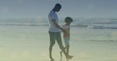 Afro-Amerikan adam ve oğlunun birlikte yürümesi üzerine ışık noktalarının animasyonu. yürüyüş günü ve dijital olarak oluşturulan video konsepti.