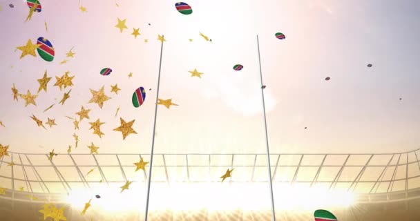 Анимация Звёзд Над Регбийными Мячами Окрашенными Флагом Намибии Падающим Стадионе — стоковое видео