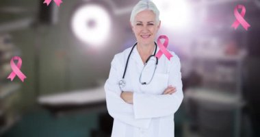 Göğüs kanseri farkındalığı kurdelelerinin mutlu beyaz kadın doktor üzerinde canlandırılması. Göğüs kanseri farkındalığı ve sağlık konsepti dijital olarak üretilen video.