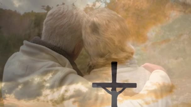 Animation Cross Sunset Back View Embracing Senior Couple Religion Faith — Stock Video