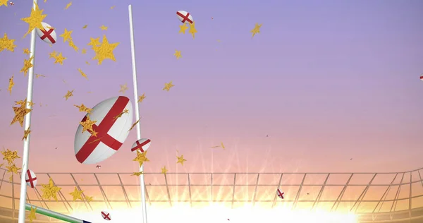 Изображение Звёзд Над Регбийными Мячами Окрашенными Английский Флаг Падающий Стадионе — стоковое фото