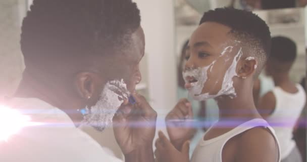 Animación Luces Sobre Feliz Afro Americano Padre Hijo Afeitando Barbas — Vídeo de stock