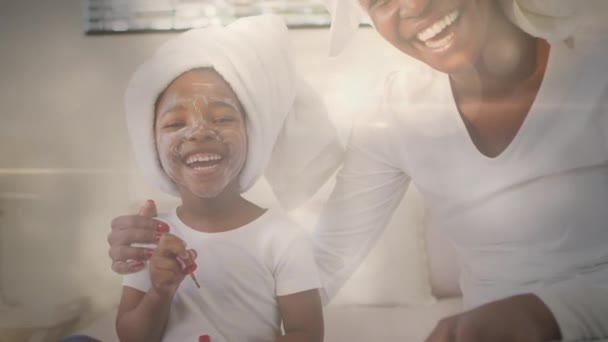 Animation Glowing Spots Happy African American Mother Daughter Face Mask — Stock Video