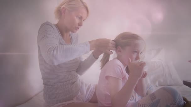 Animation Glowing Spots Happy Caucasian Mother Making Ponytail Her Daughter — Stock Video