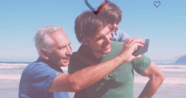 Sahilde beyaz bir ailenin üzerine düşen kalp animasyonu. moda ve yaşam tarzı konsepti dijital olarak oluşturulmuş video.