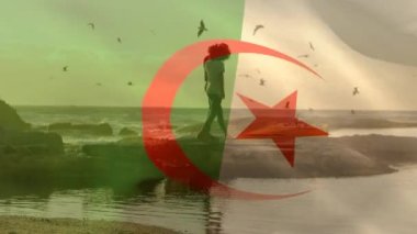 Sahildeki Afro-Amerikan çift üzerinde Cezayir bayrağının animasyonu. Vatanseverlik ve kutlama konsepti dijital olarak oluşturulmuş video.