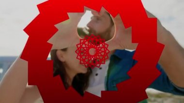 Kumsaldaki beyaz bir çiftin üzerinde kırmızı şekillerin animasyonu. Sosyal medya ve dijital arayüz kavramı dijital olarak oluşturulmuş video.