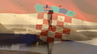 Sahildeki Afro-Amerikan çifti yerine Hırvat bayrağının canlandırılması. Vatanseverlik ve kutlama konsepti dijital olarak oluşturulmuş video.