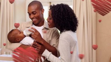 Mutlu aile yerine düşen kalplerin animasyonu. aile, sevgi, pozitif ebeveynlik ve çocukluk konsepti dijital olarak oluşturulmuş video.