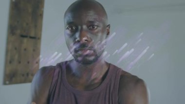 Afro-Amerikan sporcusu üzerinde mavi patikaların animasyonu. global sporlar, sağlıklı yaşam tarzı ve dijital arayüz konsepti dijital olarak oluşturulmuş video.