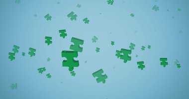 Mavi arka plana düşen yeşil yapboz parçaları. Ulusal yapboz günü ve dijital olarak oluşturulan görüntü konsepti.