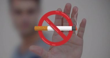 Animation of no smoking sign with cigarette over caucasian man's hand. world no tobacco day concept digitally generated video.