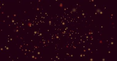 Siyah zemin üzerinde hipnotik hareketlerle uçan sarı ve kırmızı ışık noktalarının animasyonu. ışık, renk ve hareket konsepti dijital olarak oluşturulmuş video.