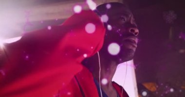 Kulaklık takan Afro-Amerikan erkek boksöre karşı yüzen parlak moleküler yapılar. spor ve spor konsepti