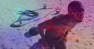 Yorgun, Afro-Amerikan formda bir adamın plajda mola vermesine karşı çok renkli DNA yapıları. spor ve spor konsepti