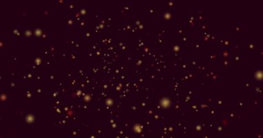 Siyah zemin üzerinde hipnotik hareketlerle uçan sarı ve kırmızı ışık lekeleri. ışık, renk ve hareket konsepti dijital olarak oluşturulmuş görüntü.