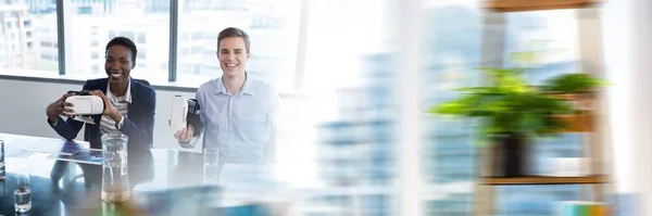 stock image Blurred effect with copy space against diverse male and female office colleagues using vr headset. business and futuristic technology concept