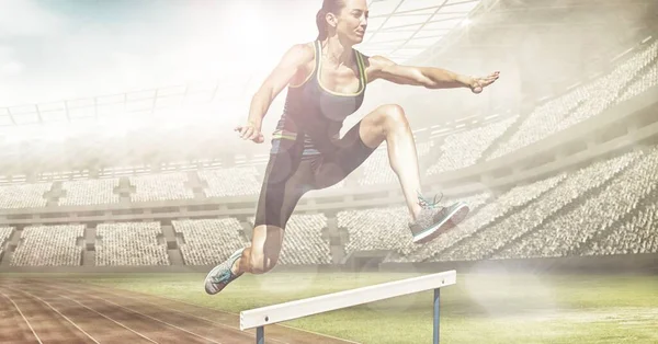 Spots Light Caucasian Female Athlete Jumping Hurdles Sports Stadium Sports — Zdjęcie stockowe
