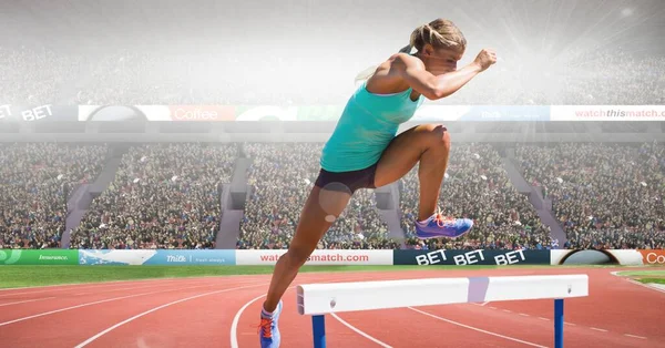 Composite Image Caucasian Female Athlete Jumping Hurdles Sports Stadium Sports — Stockfoto