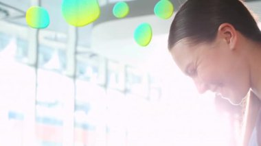 Animation of stains over smiling caucasian businesswoman using smartphone. social media and communication interface concept digitally generated video.