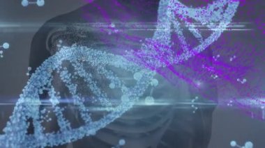 DNA iplikçiklerinin ve moleküllerin insan vücudu üzerinde dönmesinin animasyonu. küresel bilim, tıp ve veri işleme kavramı dijital olarak oluşturulmuş video.