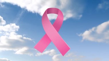 Bulutlu gökyüzünde pembe kurdelenin animasyonu. Göğüs kanseri pozitif farkındalık kampanyası konsepti dijital olarak üretildi.