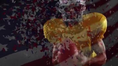 Amerikan futbolcusunun üzerine bayrak sallayıp konfeti düşürme animasyonu. küresel spor ve yarışma konsepti dijital olarak oluşturulmuş video.