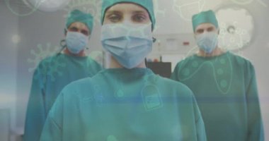 Cerrahi maske takan kadın ve erkek cerrahlara karşı çoklu covid-19 konsept simgeleri. Sağlık ve covid-19 salgın konsepti