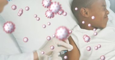 Covid-19 hücreleri doktorlara karşı yüzüyorlar ve hastanedeki Afrikalı Amerikalı çocuğa iğne yapıyorlar. Sağlık ve covid-19 salgın konsepti