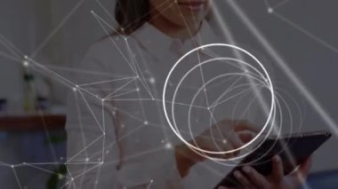 Animation of network of connections over female biracial female doctor. global science, connections, data processing and digital interface concept digitally generated video.