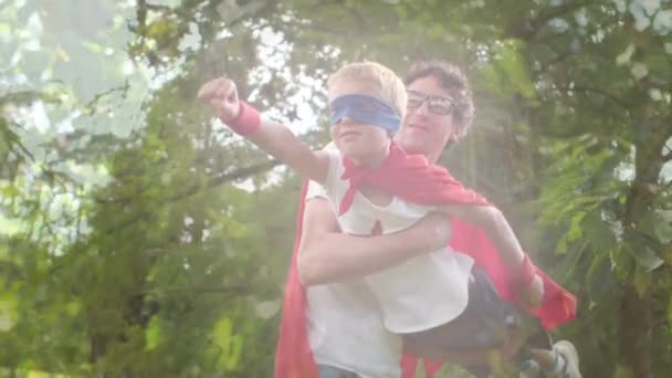 Animation Foliage Happy Caucasian Father Son Having Fun Dressed Superheroes — Video Stock