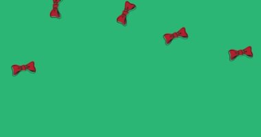 Animation of bow ties falling over green background. clothes, shapes and movement concept digitally generated video.